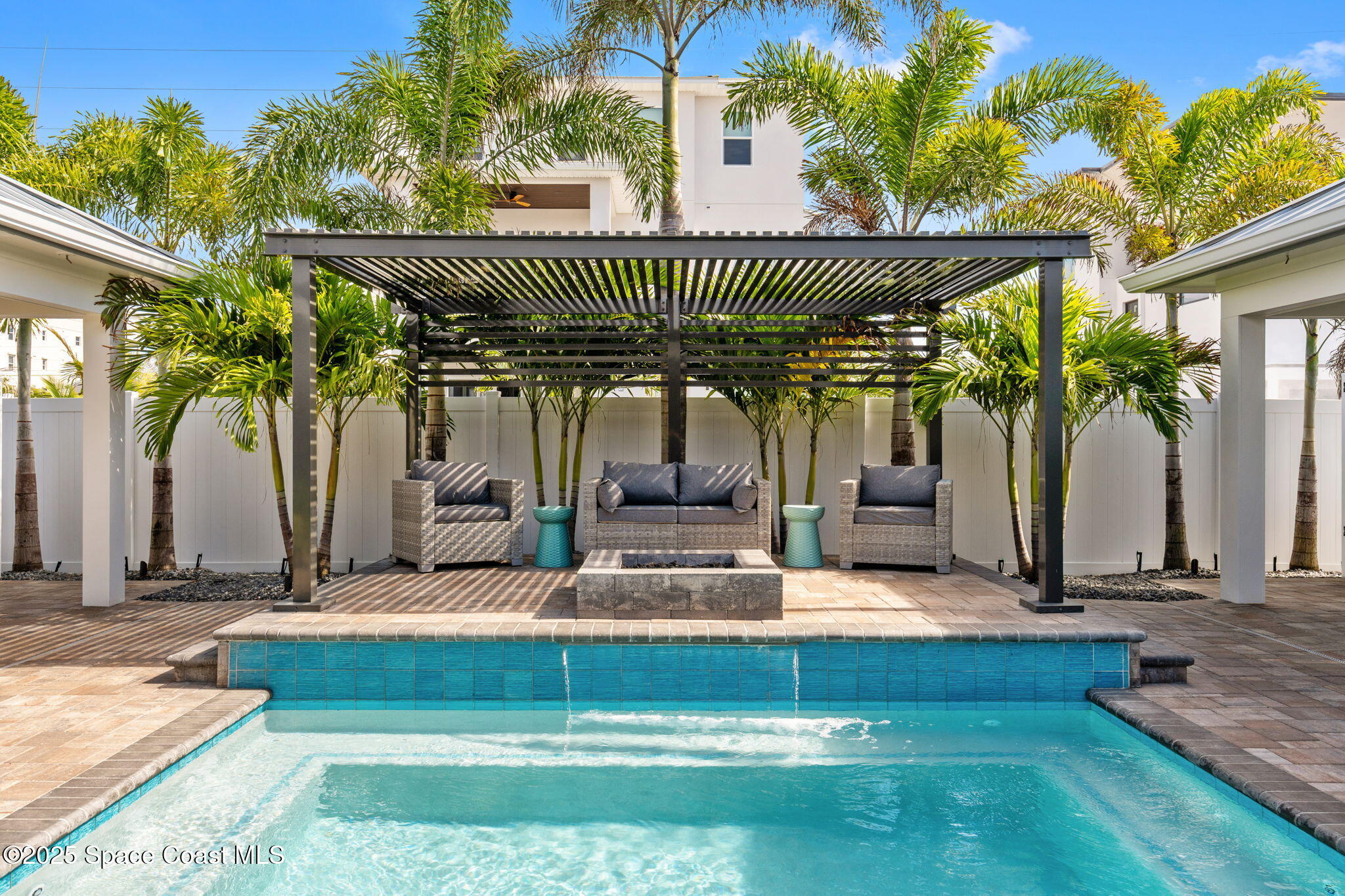 2021 South Orlando Avenue Cocoa Beach, FL 32931 - Photo 4 of 42 a view of swimming pool with a patio