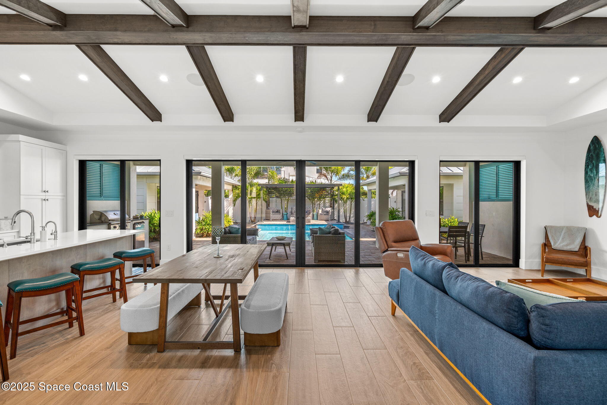 2021 South Orlando Avenue Cocoa Beach, FL 32931 - Photo 5 of 42 a living room with furniture and large windows