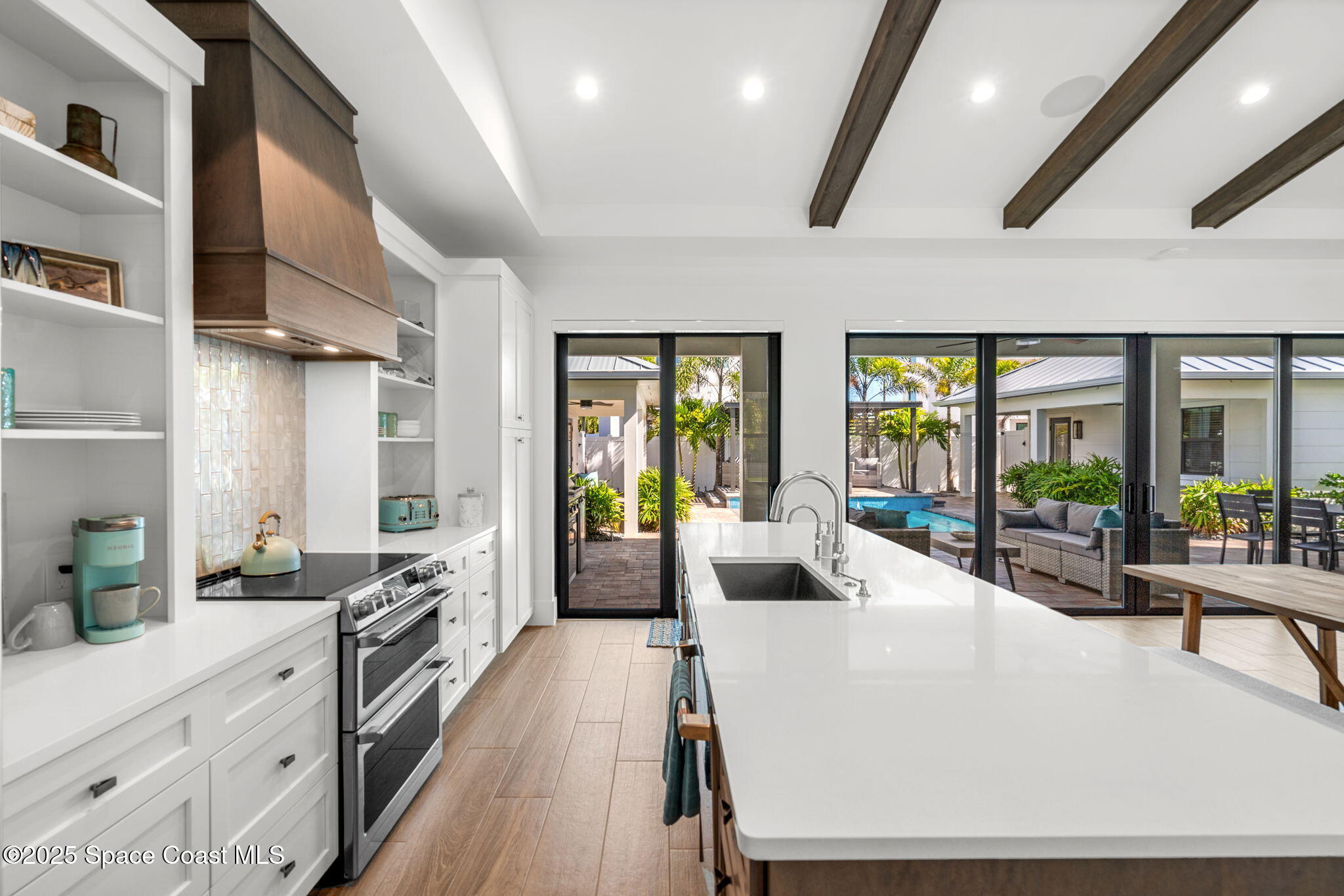 2021 South Orlando Avenue Cocoa Beach, FL 32931 - Photo 8 of 42 a large white kitchen with lots of counter top space