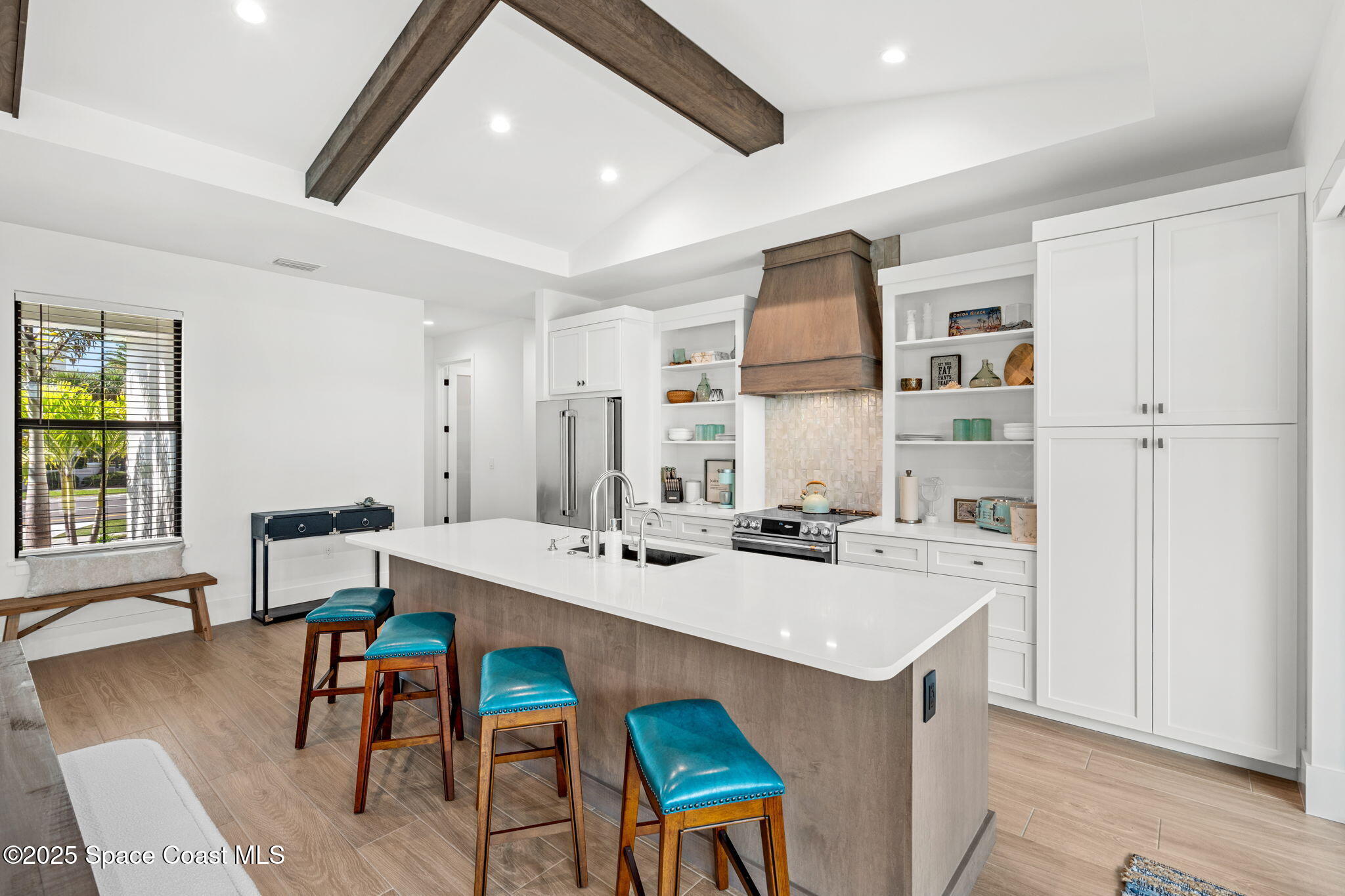 2021 South Orlando Avenue Cocoa Beach, FL 32931 - Photo 10 of 42 a view of a dining room with furniture and wooden floor