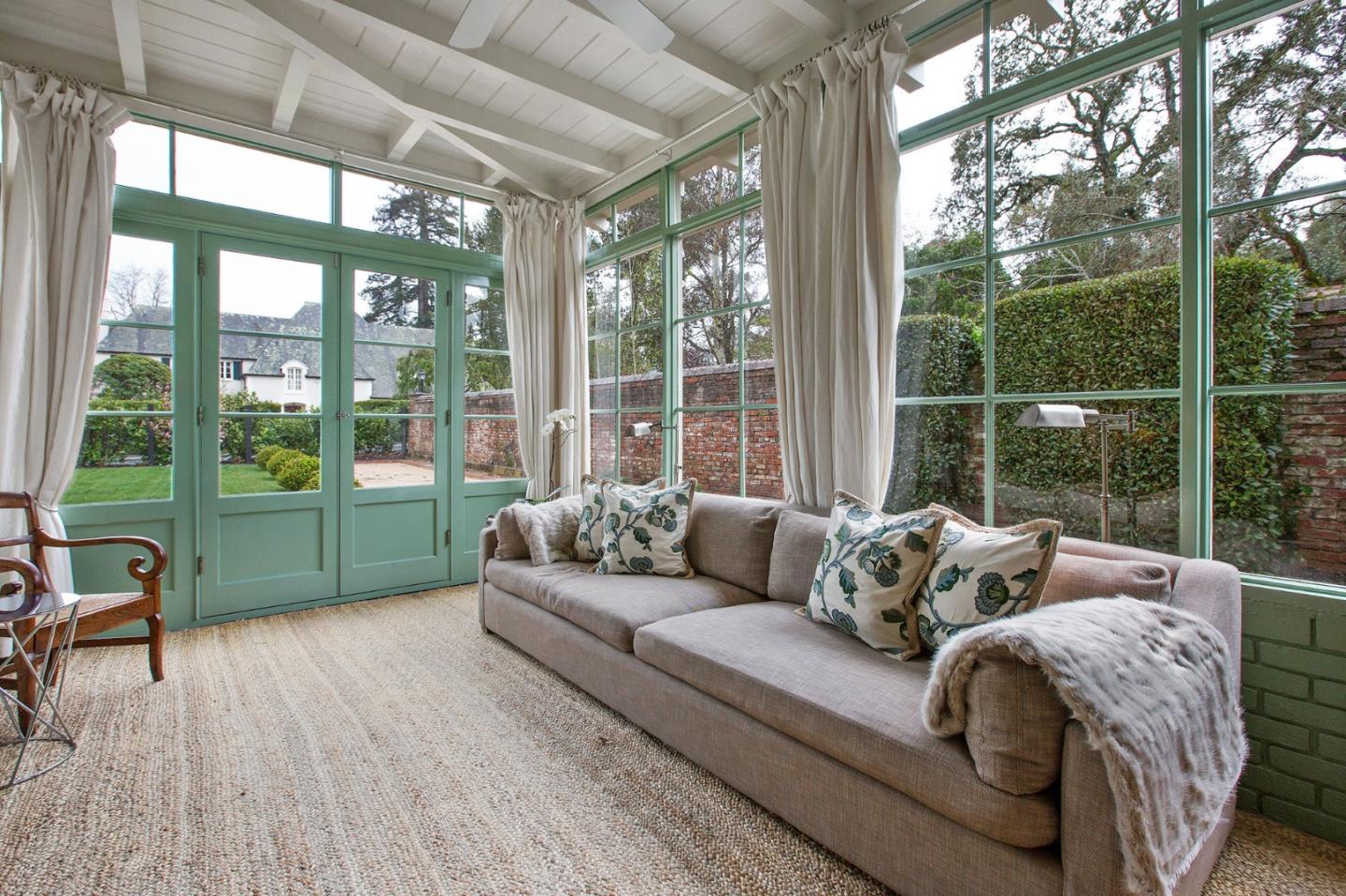 508 Roehampton Road Hillsborough, CA 94010 - Photo 15 of 50 a living room with furniture and a floor to ceiling window