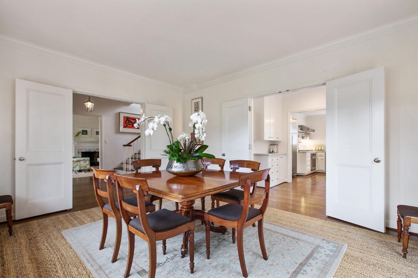 508 Roehampton Road Hillsborough, CA 94010 - Photo 20 of 50 a dining room with furniture and wooden floor