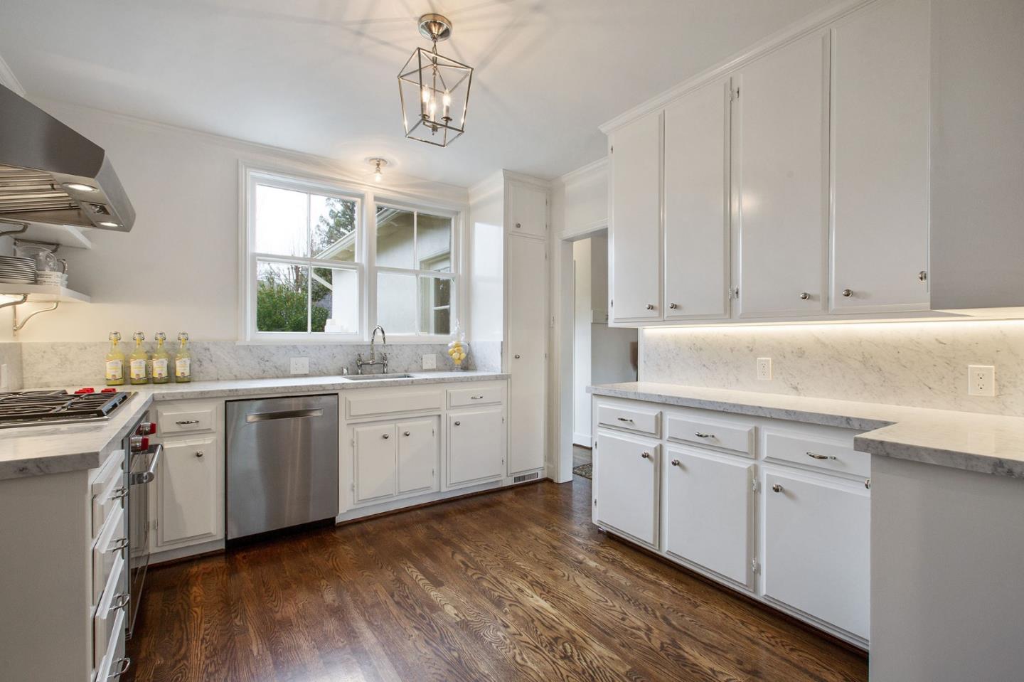 508 Roehampton Road Hillsborough, CA 94010 - Photo 21 of 50 a kitchen with a sink cabinets and window