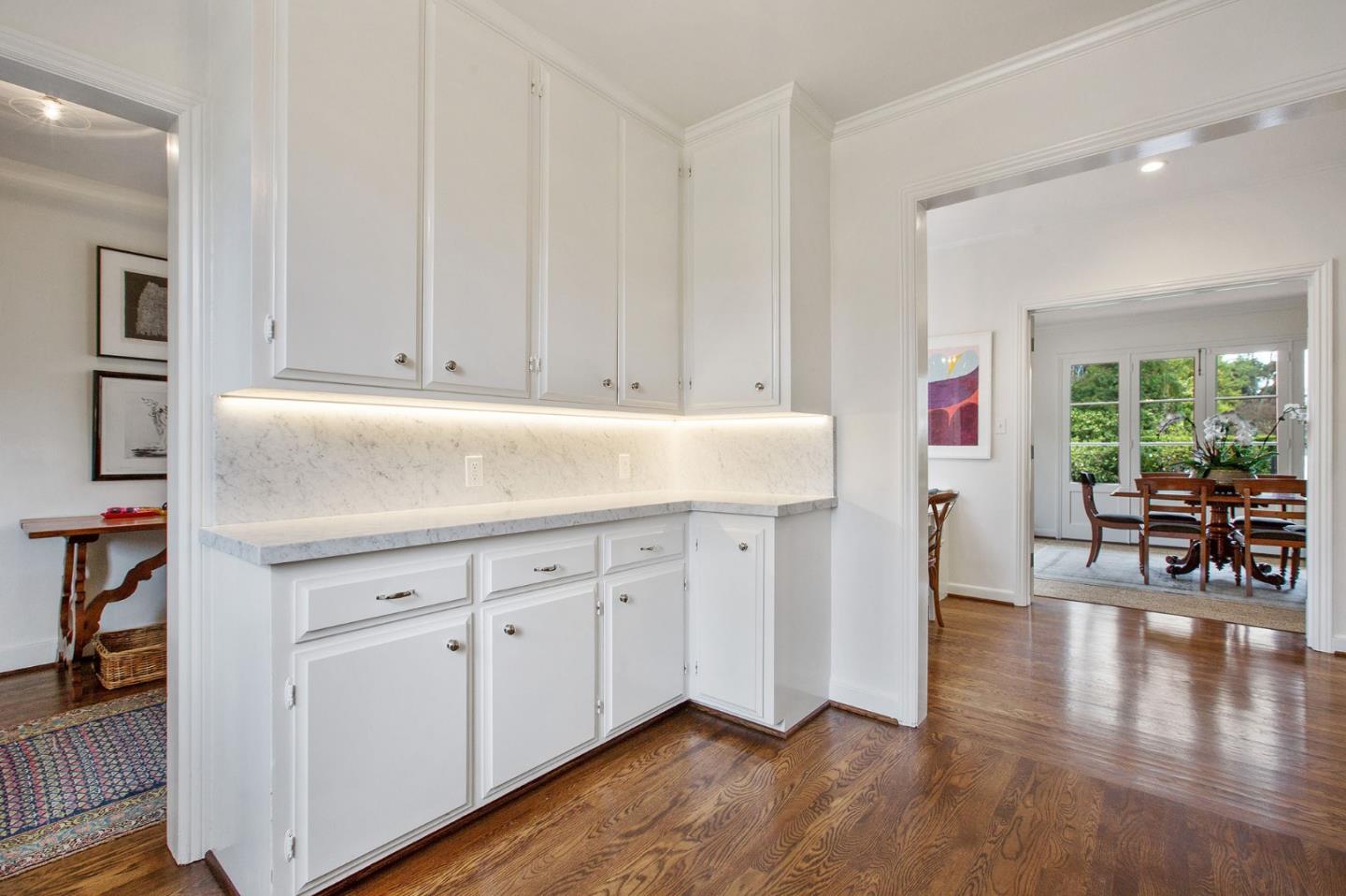 508 Roehampton Road Hillsborough, CA 94010 - Photo 23 of 50 a kitchen with granite countertop cabinets and wooden floor