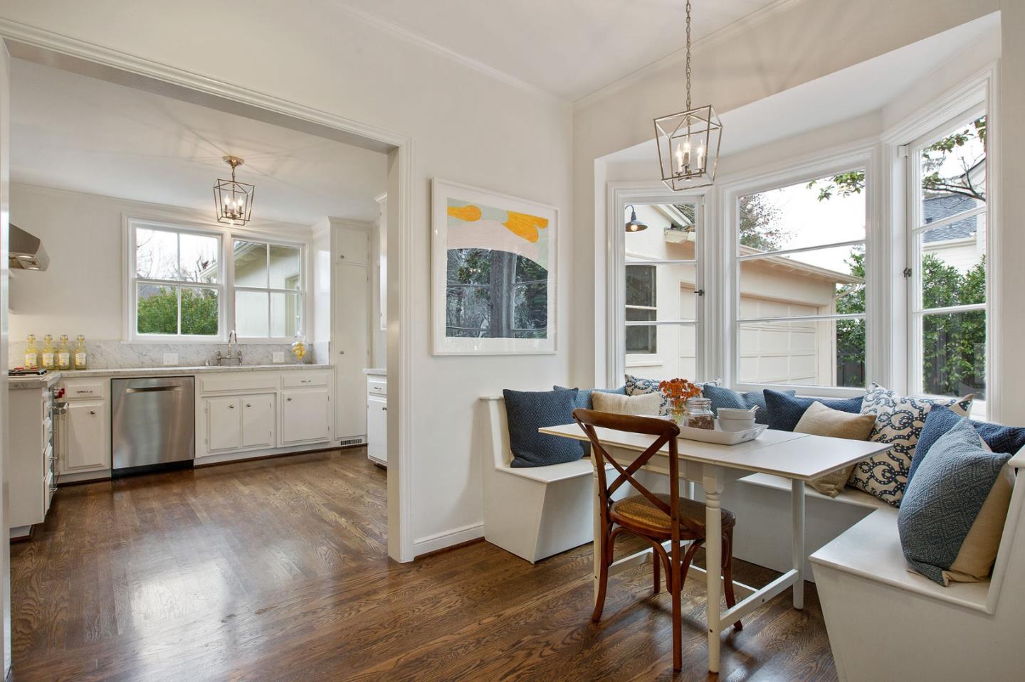 508 Roehampton Road Hillsborough, CA 94010 - Photo 25 of 50 a view of a dining room and livingroom with furniture wooden floor a chandelier