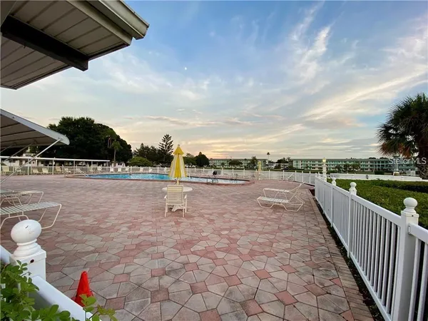a view of a swimming pool with a patio