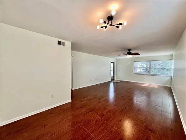 a kitchen with stainless steel appliances granite countertop a refrigerator a stove and a sink