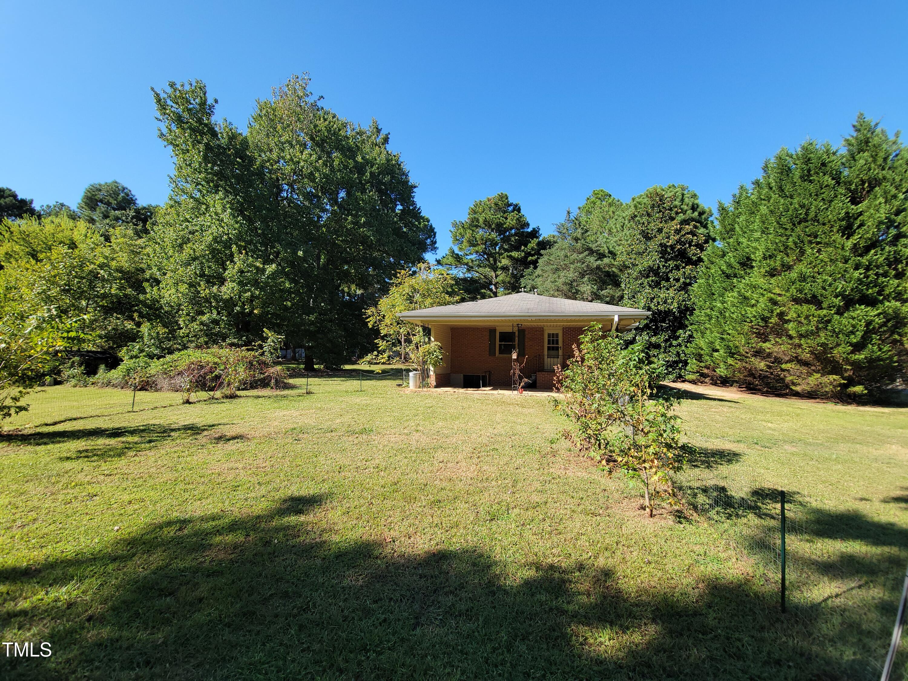 7000 Holly Springs Road Raleigh, NC 27606 - Photo 24 of 24 a big yard with lots of green space