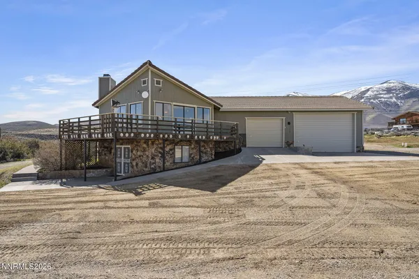 a front view of a house with a wooden fence
