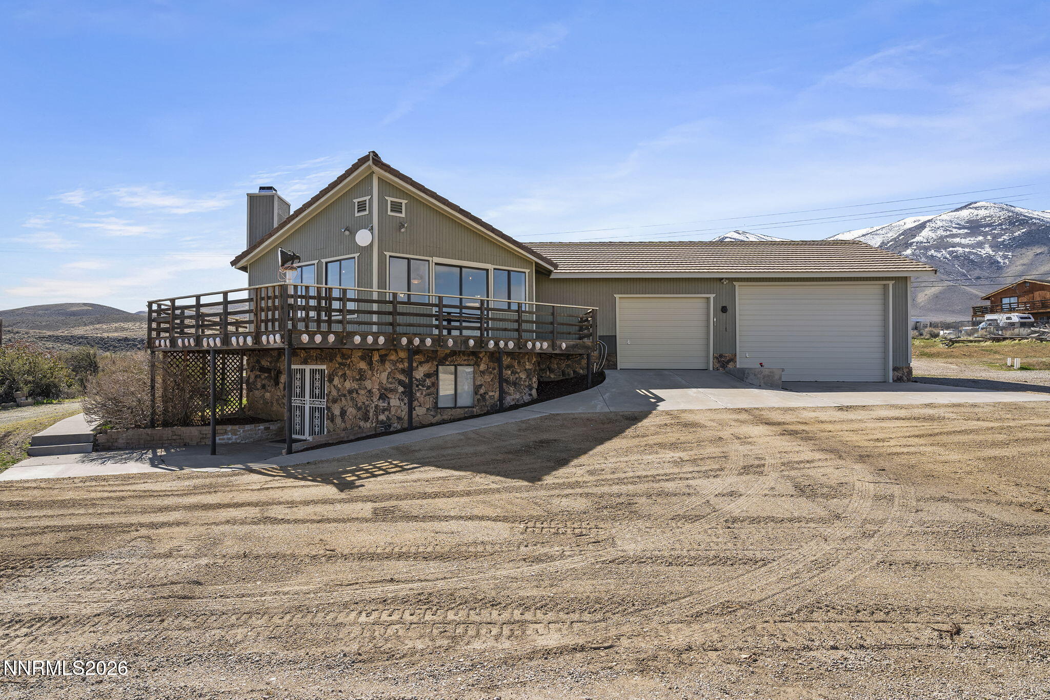 9906 North Virginia Street Reno, NV 89506 - Photo 1 of 36 a front view of a house with a wooden fence