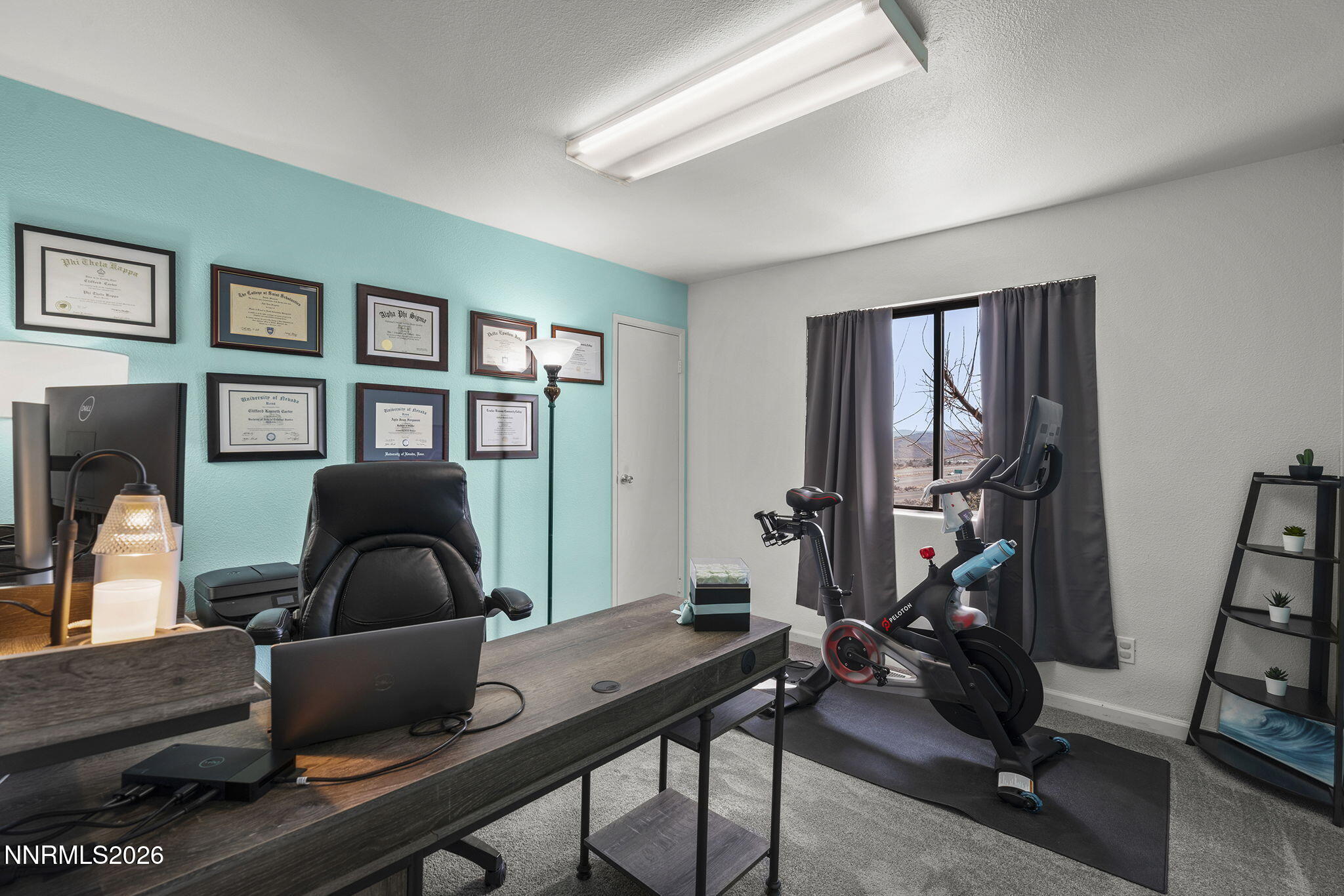 9906 North Virginia Street Reno, NV 89506 - Photo 12 of 36 a living room with furniture wall paintings and a window