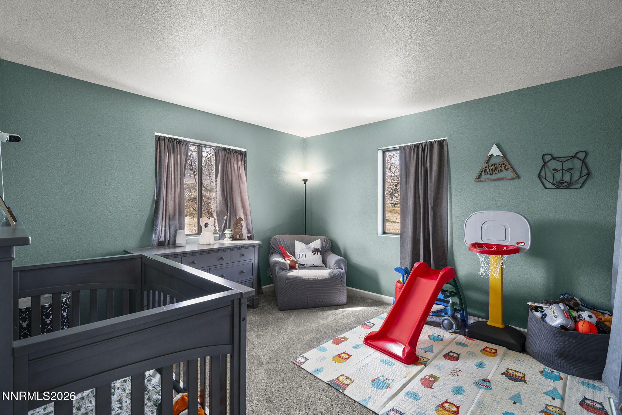 9906 North Virginia Street Reno, NV 89506 - Photo 14 of 36 a bedroom with furniture and a book shelf