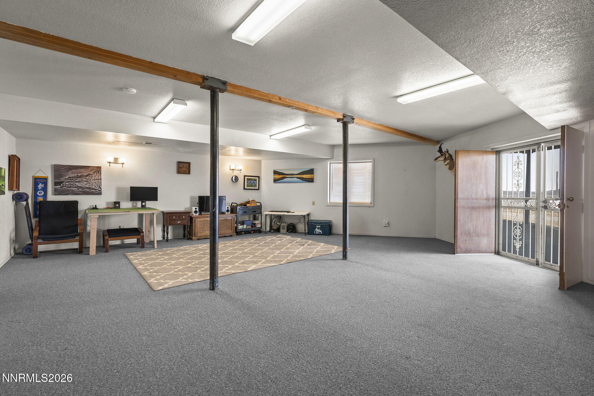 9906 North Virginia Street Reno, NV 89506 - Photo 17 of 36 a view of a livingroom with furniture and a projector