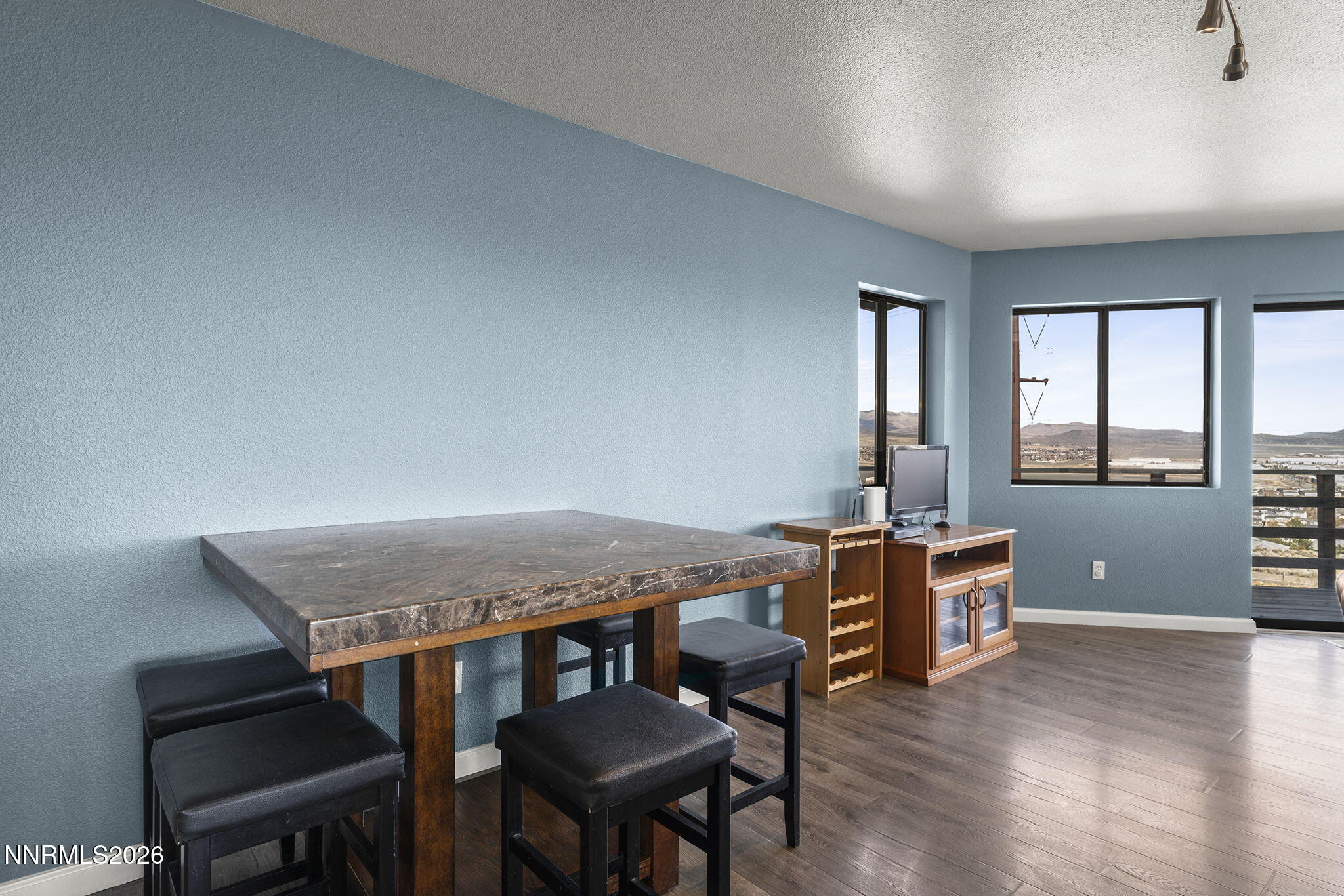 9906 North Virginia Street Reno, NV 89506 - Photo 6 of 36 a view of a livingroom with furniture window and wooden floor