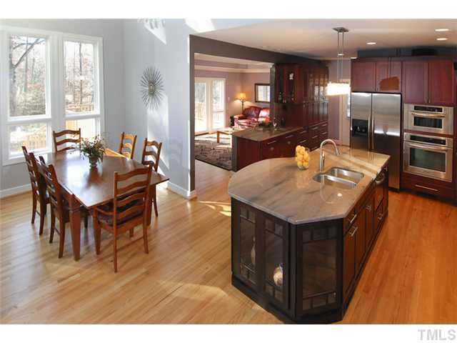 12100 Betts Lane Raleigh, NC 27614 - Photo 3 of 17 New gourmet kitchen is absolutely gorgeous! Brazilian granite counter tops, stainless steel appliances, and tons of space. Whole home creates an ideal open feel. Kitchen