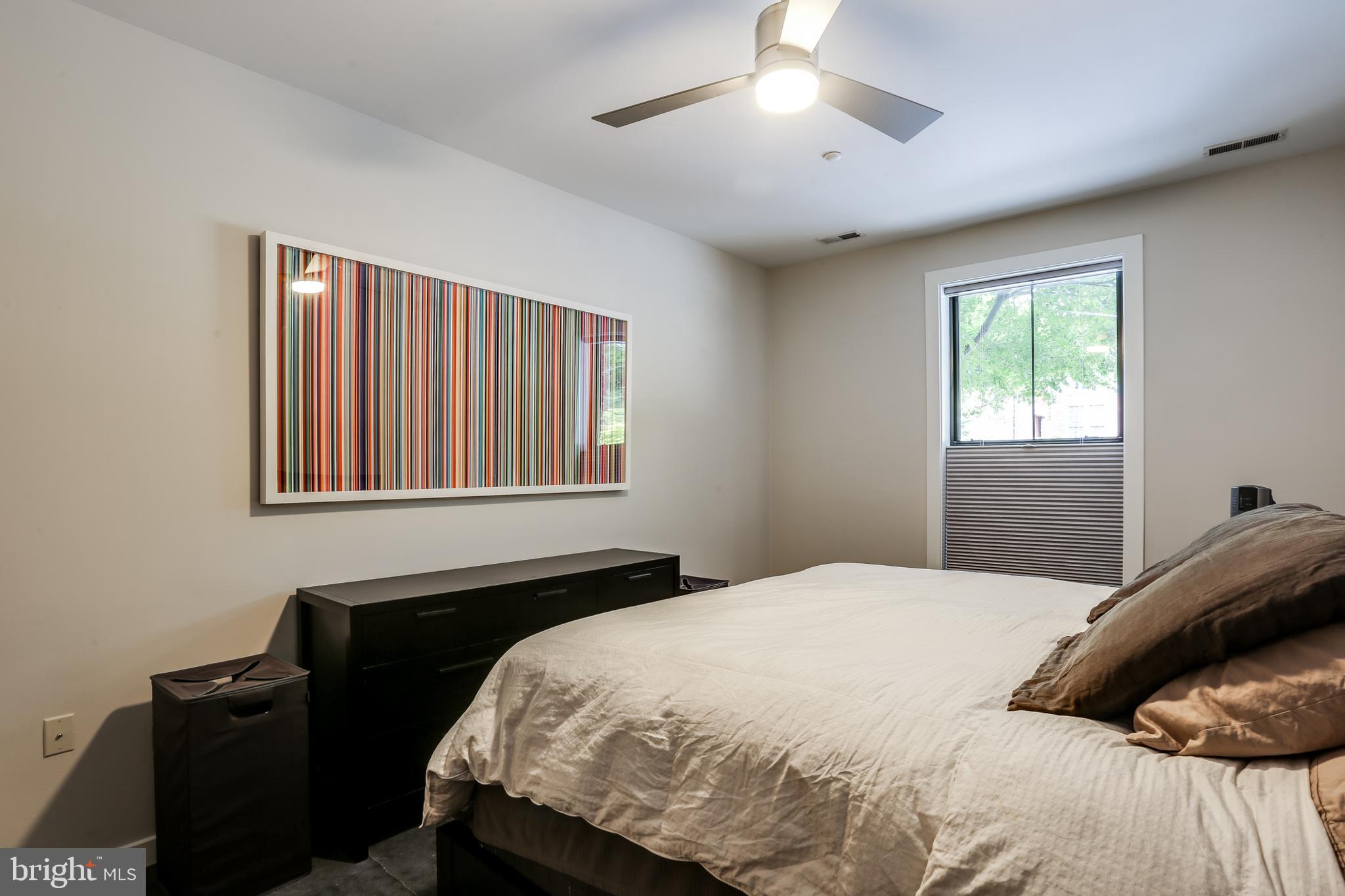 2007 Clipper Park Road, Unit 124 Baltimore, MD 21211 - Photo 21 of 35 a bedroom with a bed and a window