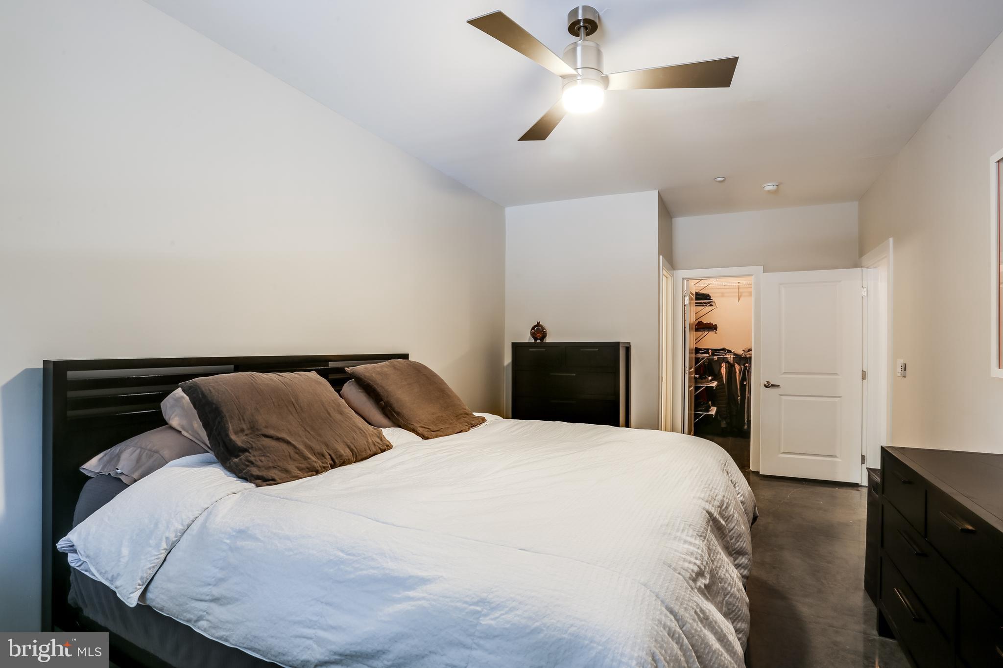 2007 Clipper Park Road, Unit 124 Baltimore, MD 21211 - Photo 22 of 35 a bedroom with a bed and ceiling fan