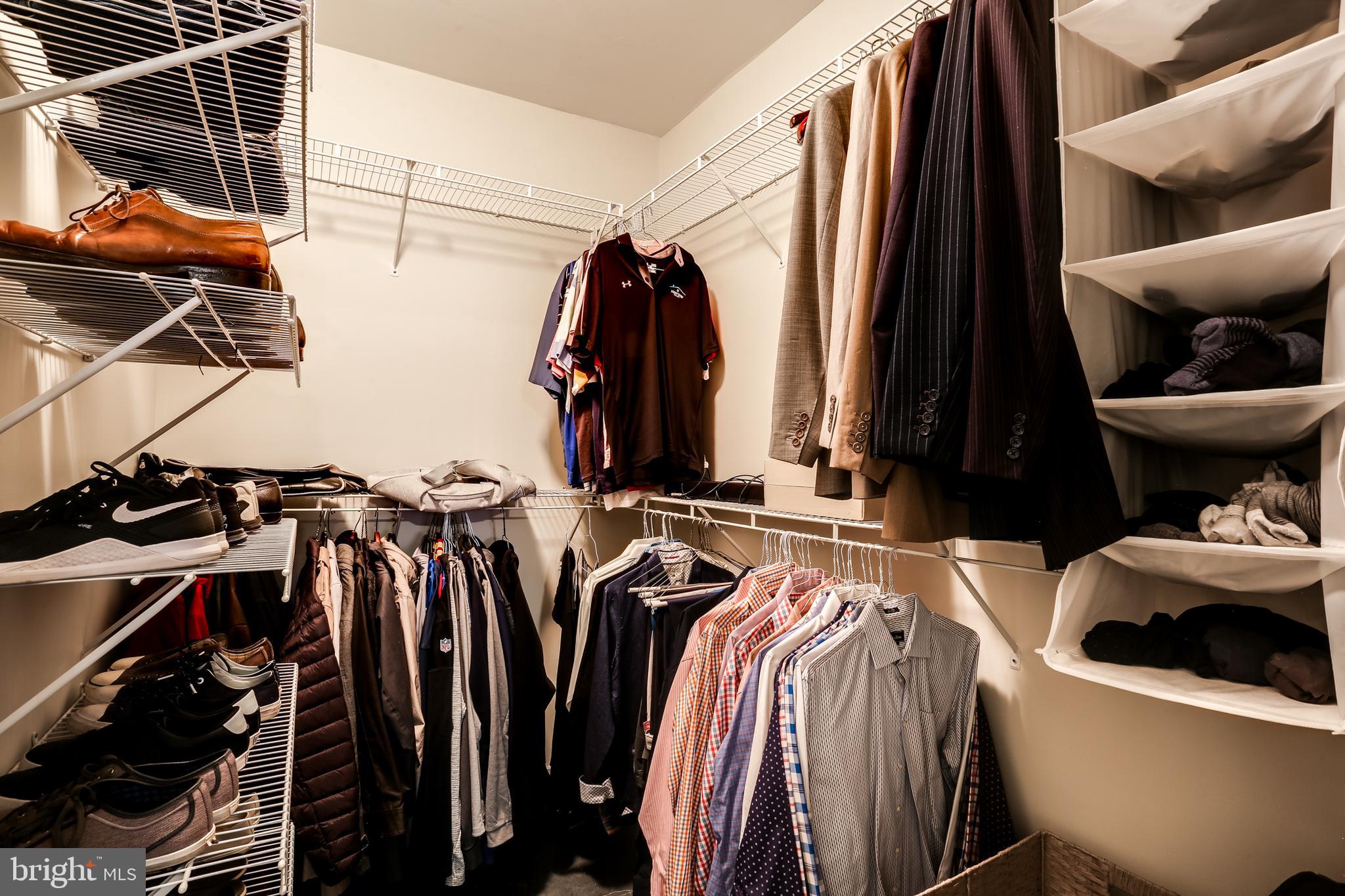2007 Clipper Park Road, Unit 124 Baltimore, MD 21211 - Photo 24 of 35 a view of walk in closet with clothes and shoes