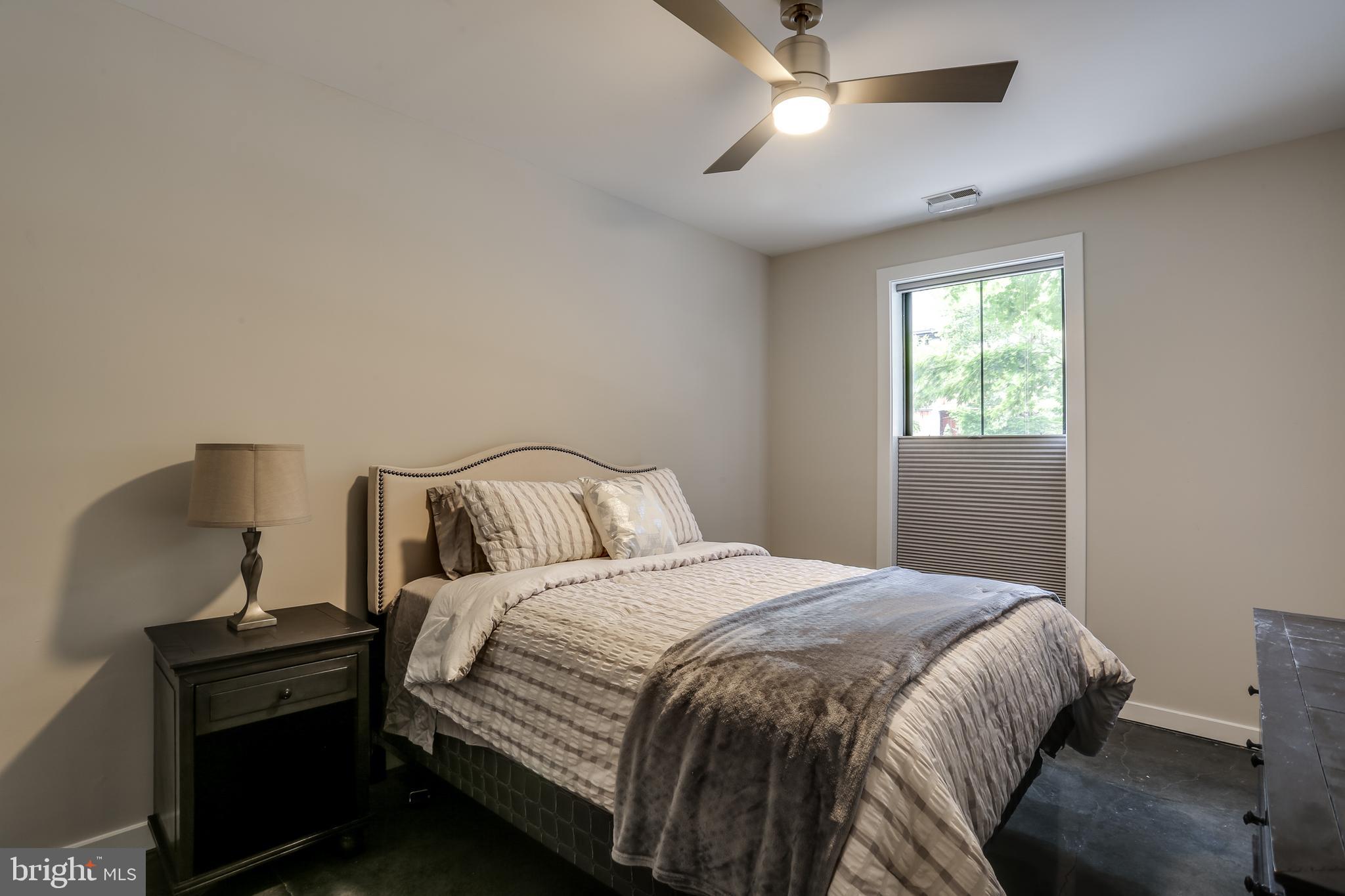 2007 Clipper Park Road, Unit 124 Baltimore, MD 21211 - Photo 26 of 35 a bedroom with a bed and window