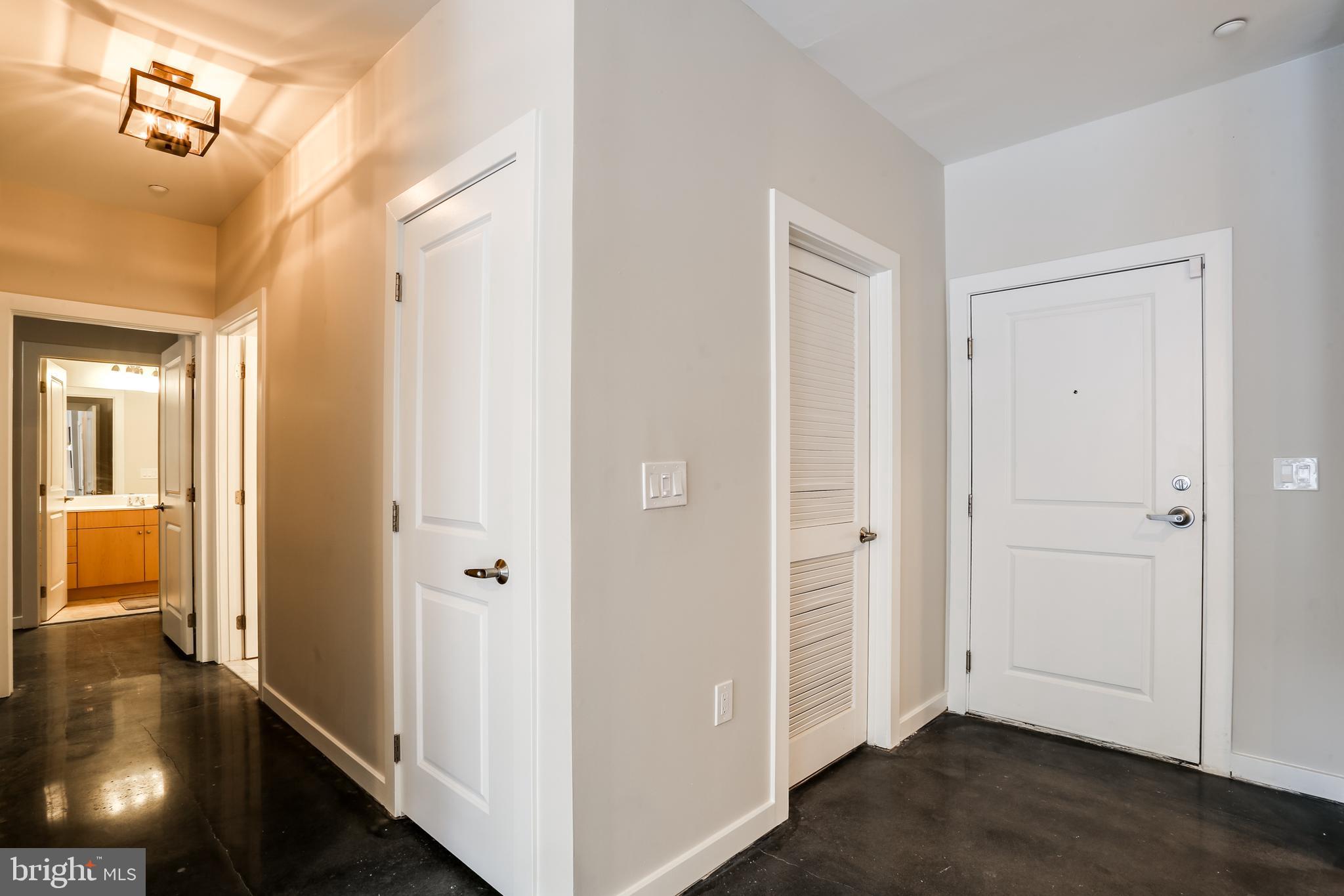 2007 Clipper Park Road, Unit 124 Baltimore, MD 21211 - Photo 28 of 35 a view of a hallway with wooden floor and closet area
