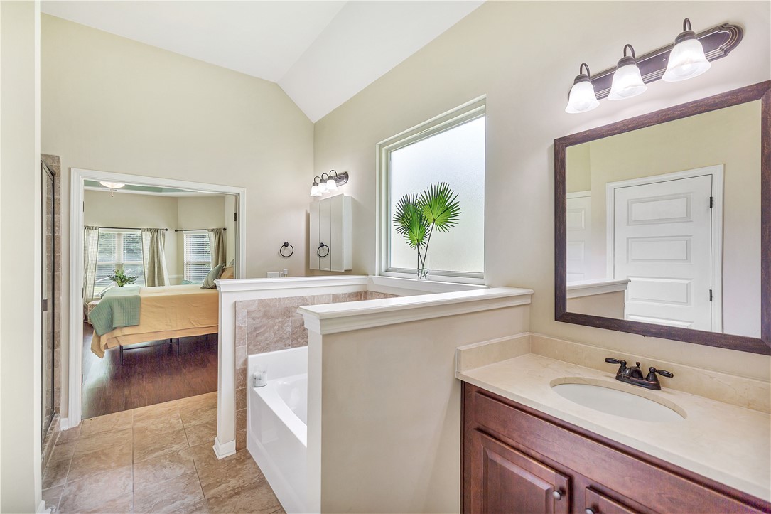 144 Buckland Drive Anderson, SC 29621 - Photo 9 of 48 Indulge in a tranquil primary bathroom featuring a spacious soaking tub and a sleek vanity.