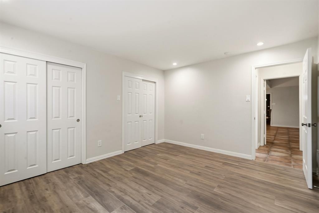 7354 Walling Lane Dallas, TX 75231 - Photo 14 of 28 a view of an empty room with wooden floor