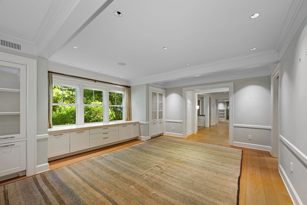 29 Merrill Road Newton, MA 02459 - Photo 14 of 42 a view of empty room with wooden floor and fan