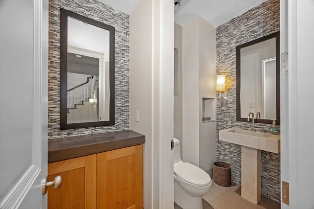 a utility room with sink dryer and washer