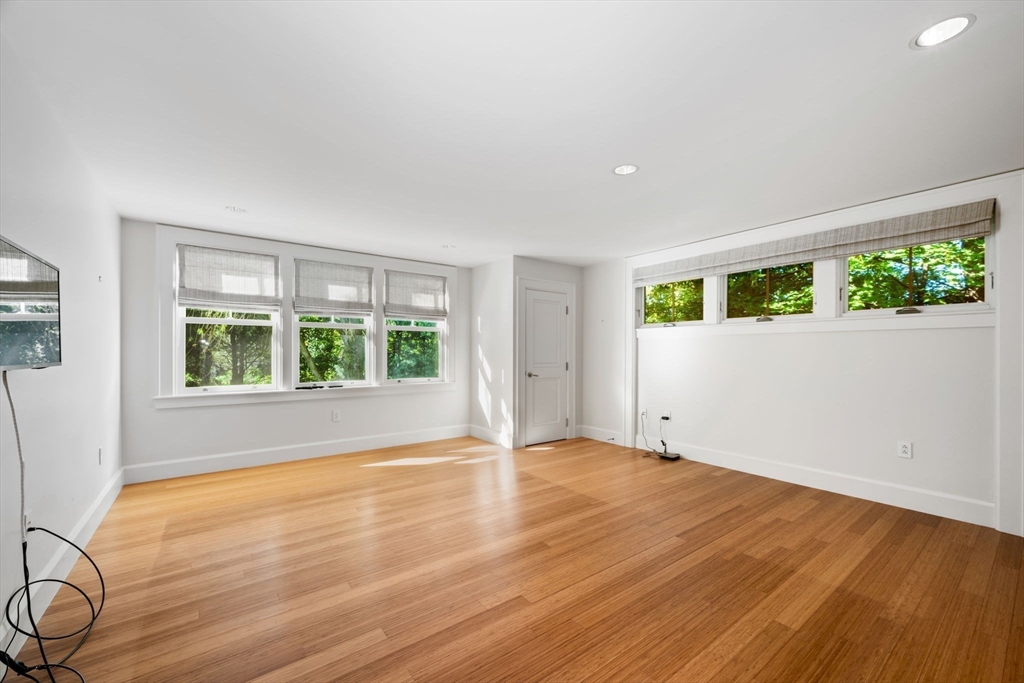 29 Merrill Road Newton, MA 02459 - Photo 17 of 42 a view of an empty room with wooden floor and a window