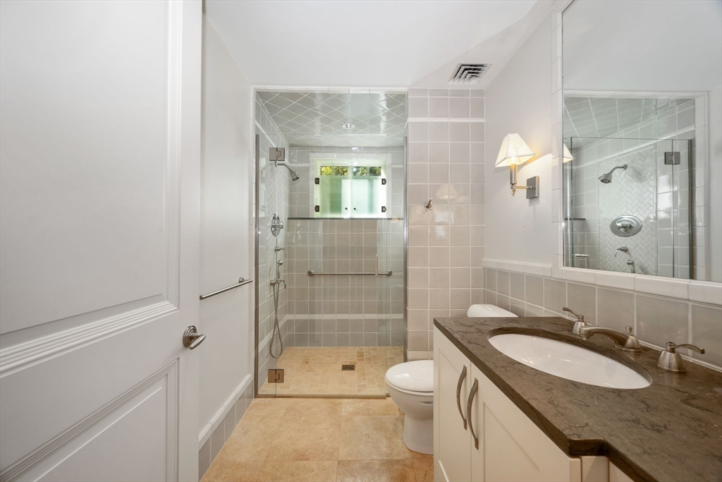 29 Merrill Road Newton, MA 02459 - Photo 18 of 42 a bathroom with a granite countertop sink toilet and shower