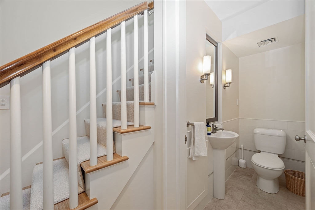 29 Merrill Road Newton, MA 02459 - Photo 27 of 42 a bathroom with a toilet a sink and shower