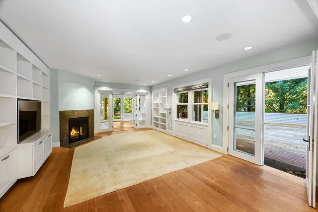 a view of a livingroom with a fireplace and a flat screen tv