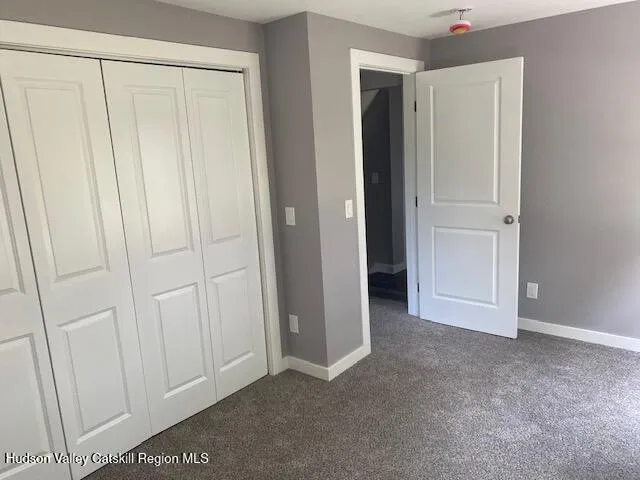 an empty room with closet area