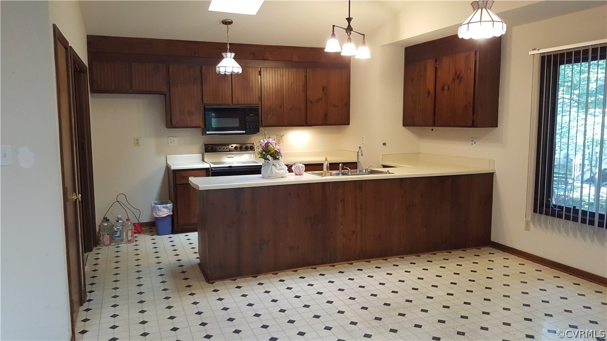 4801 Fordham Road Chesterfield, VA 23236 - Photo 4 of 15 a kitchen with a sink a stove and cabinets
