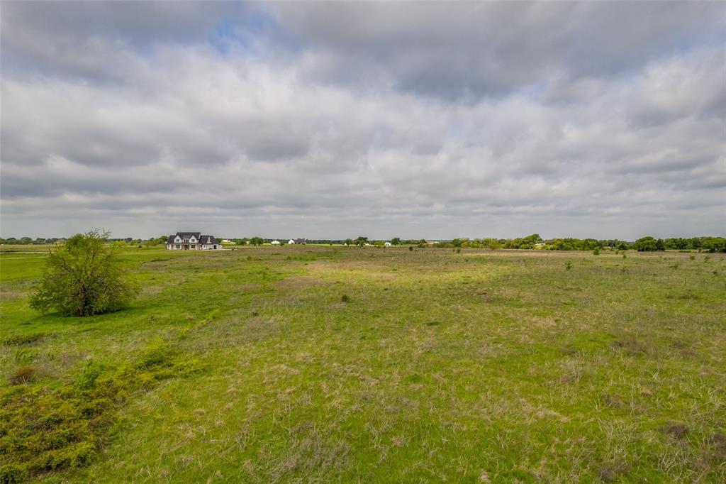 6593 Preston Road Denison, TX 75020 - Photo 7 of 7 a view of a large body of water with a building in the background