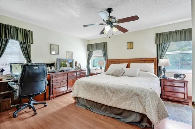 a bedroom with a bed a desk and chair