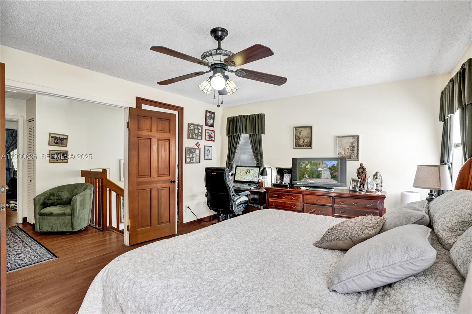 11728 Southwest 118th Terrace Miami, FL 33186 - Photo 12 of 31 a bedroom with furniture and a wooden floor