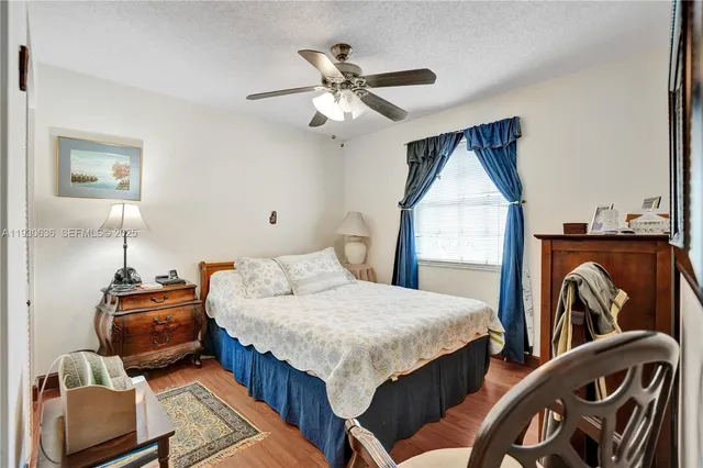 a bedroom with furniture and wooden floor