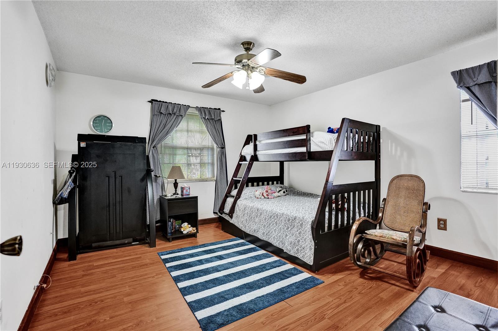 11728 Southwest 118th Terrace Miami, FL 33186 - Photo 16 of 31 a bedroom with furniture and a window