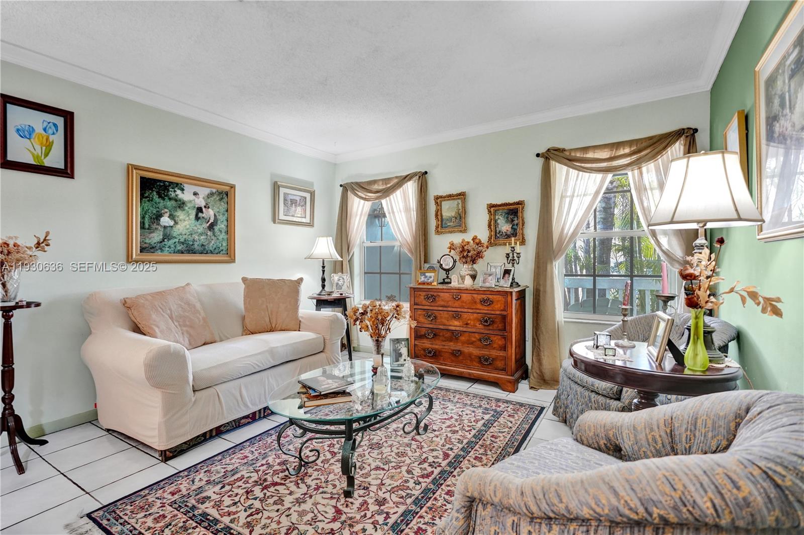11728 Southwest 118th Terrace Miami, FL 33186 - Photo 2 of 31 a living room with furniture and a large window