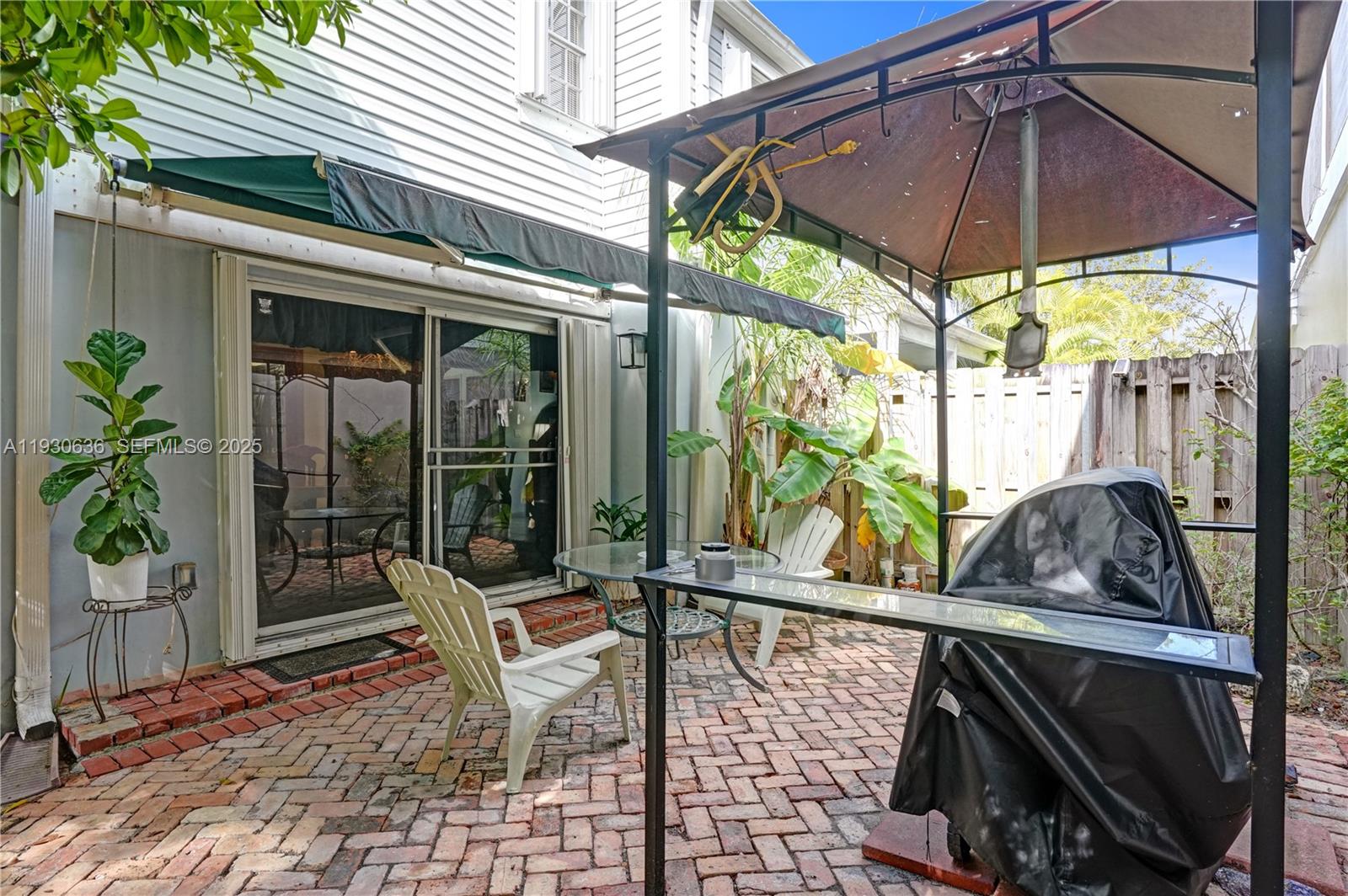 11728 Southwest 118th Terrace Miami, FL 33186 - Photo 23 of 31 a view of an outdoor sitting area with porch