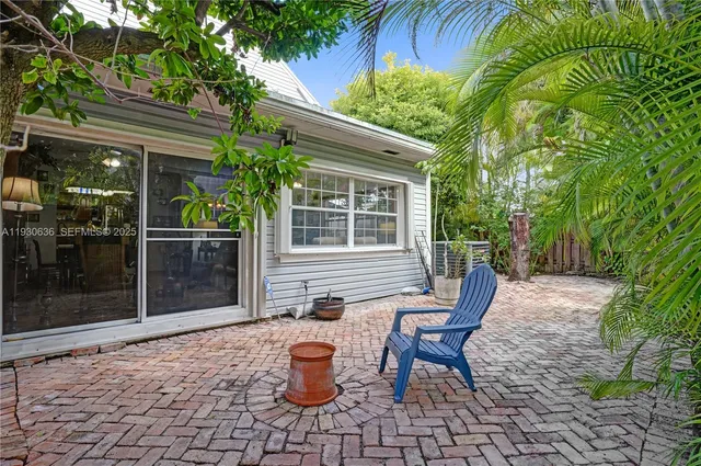 a backyard of a house with seating space