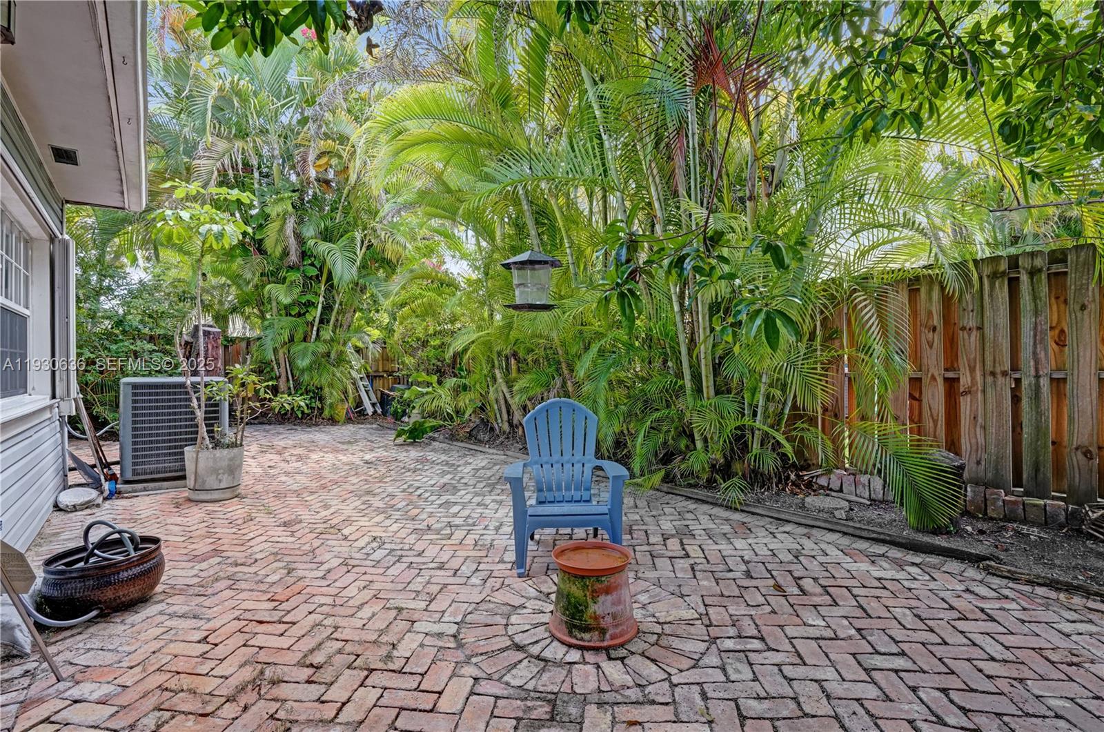 11728 Southwest 118th Terrace Miami, FL 33186 - Photo 26 of 31 a garden view with a seating space