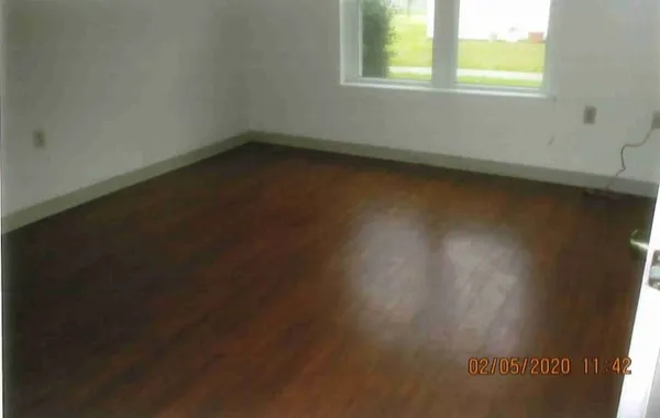 a view of a room that has a window in it