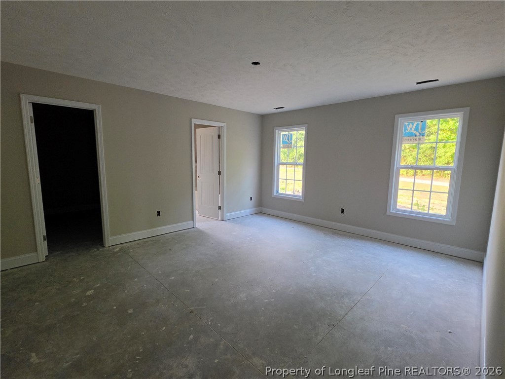 756 Jordan Road Autryville, NC 28318 - Photo 16 of 34 a view of an empty room with a window