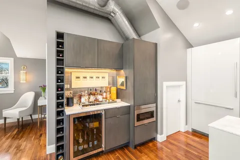a kitchen with stainless steel appliances granite countertop a stove and a refrigerator