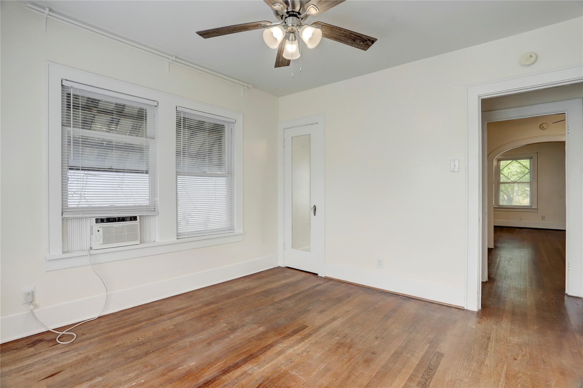 607 West Pierce Street Houston, TX 77019 - Photo 13 of 20 a view of empty room with wooden floor and fan