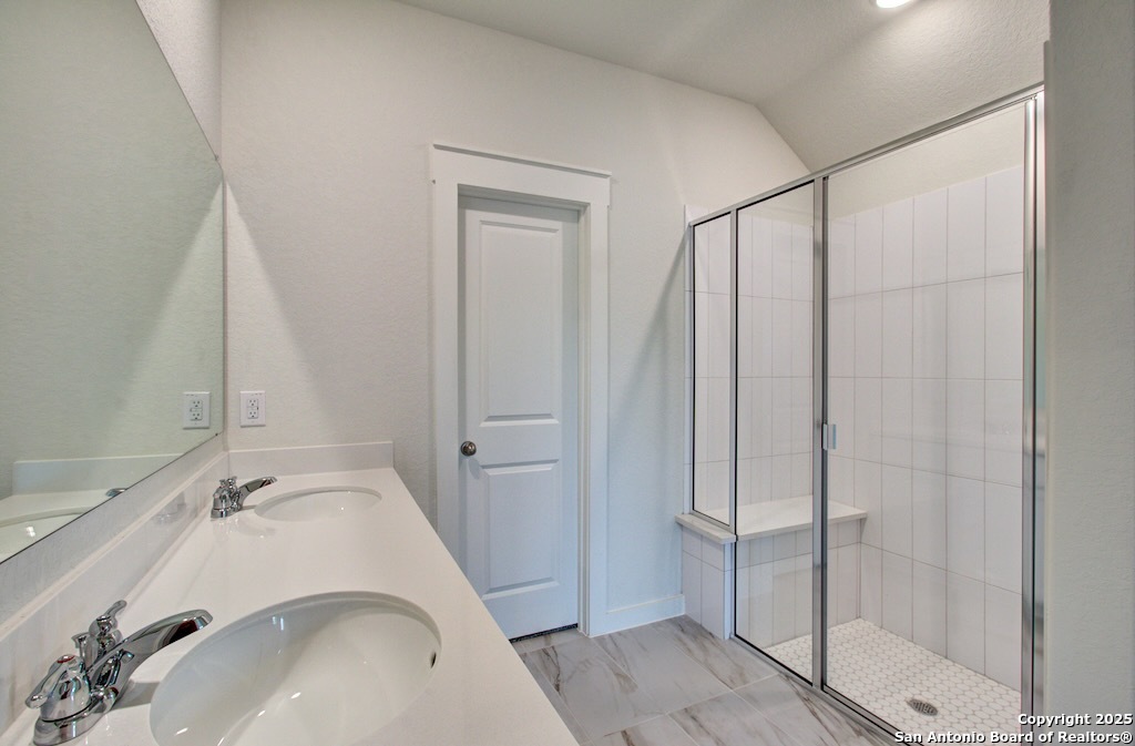 3625 Meteor Road New Braunfels, TX 78130 - Photo 15 of 39 a bathroom with a sink and shower