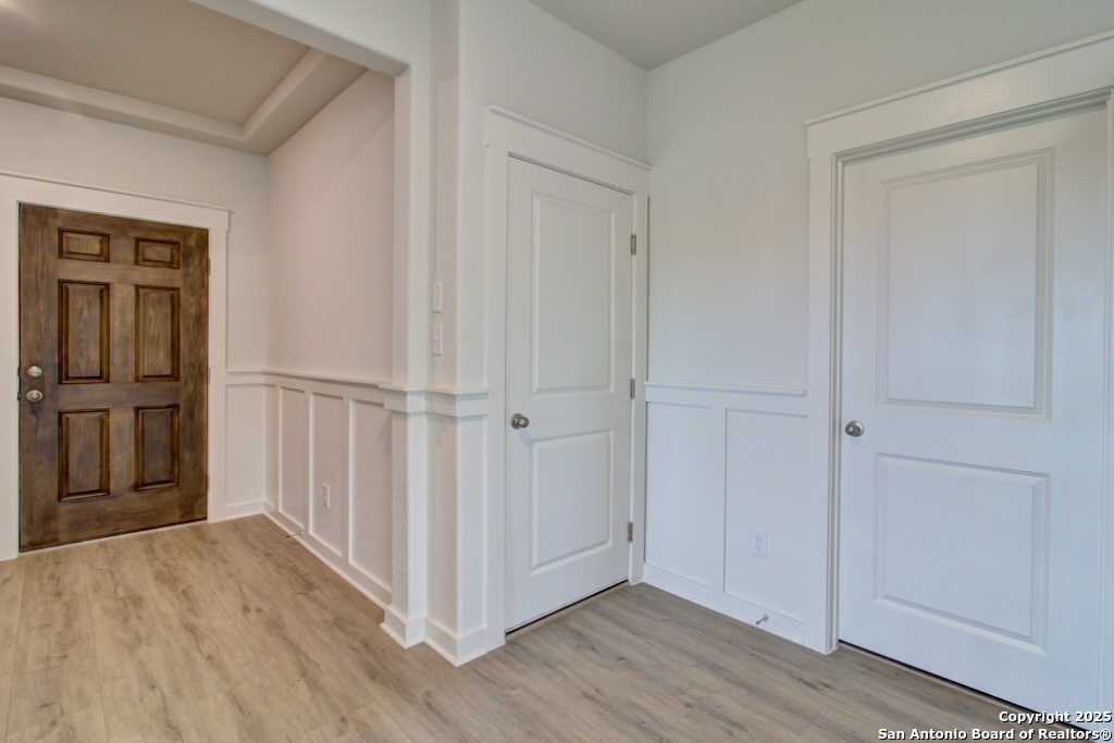 3625 Meteor Road New Braunfels, TX 78130 - Photo 17 of 39 a view of a hallway with wooden floor and entryway