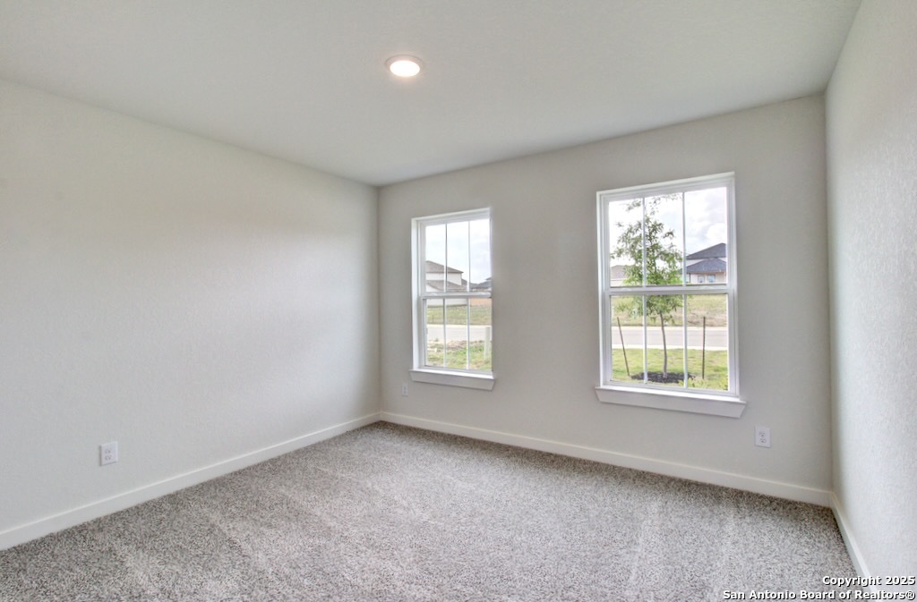 3625 Meteor Road New Braunfels, TX 78130 - Photo 23 of 39 an empty room with windows